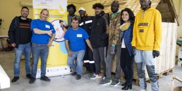 The group of migrants and refugees with instructors of the carpentry course